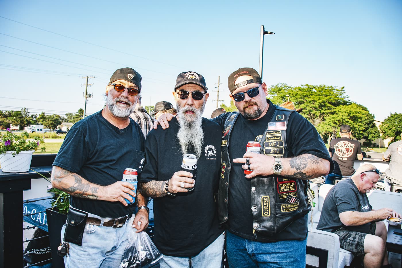 Riders with drinks on the patio