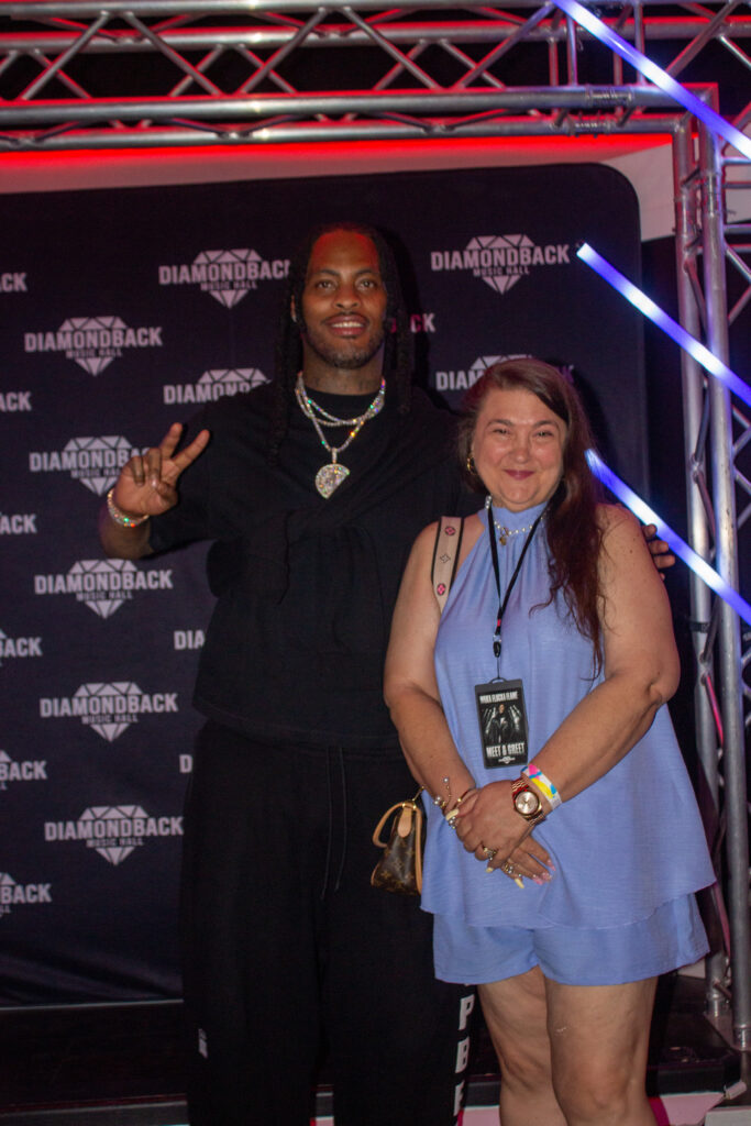 Fan posing with Waka Flocka Flame at the meet and greet at Diamondback Music Hall