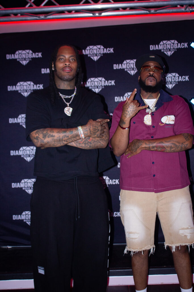 Fan posing with Waka Flocka Flame at the meet and greet at Diamondback Music Hall