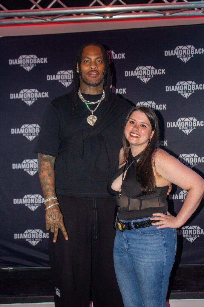 Fan posing with Waka Flocka Flame at the meet and greet at Diamondback Music Hall