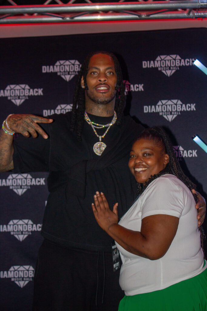 Fan posing with Waka Flocka Flame at the meet and greet at Diamondback Music Hall