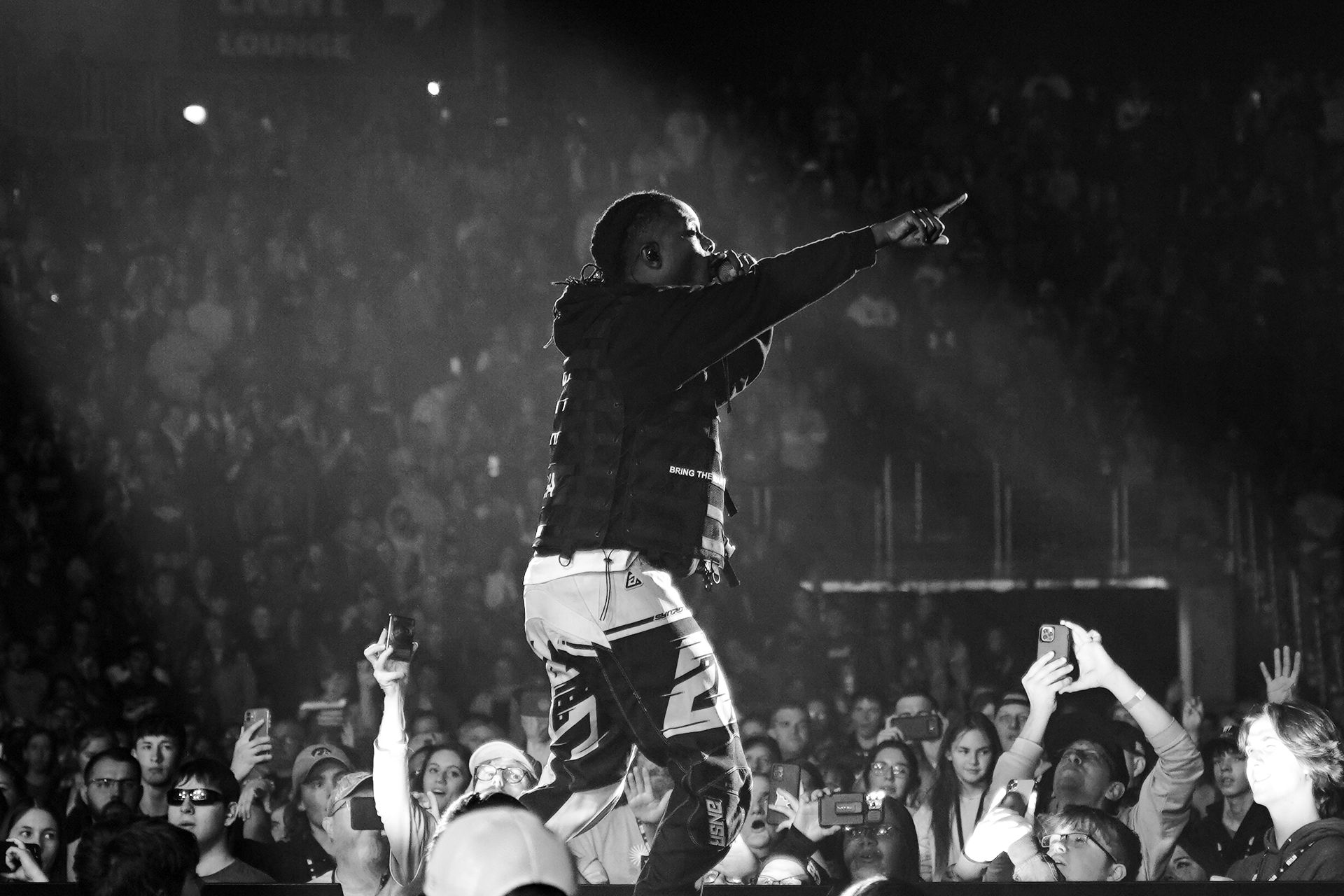 KB on stage in front of a packed arena crowd