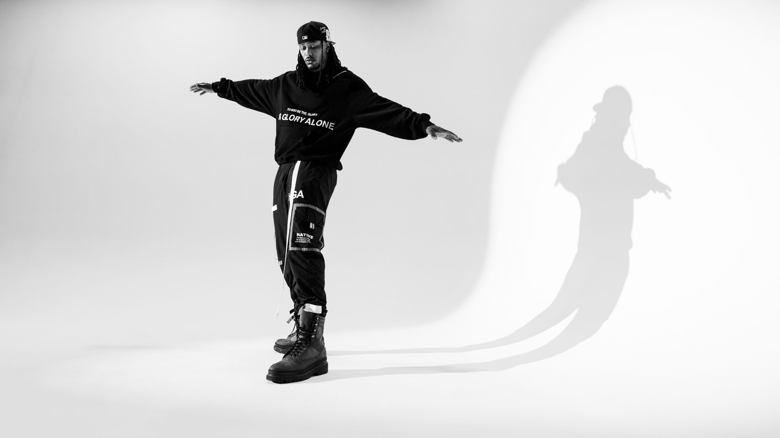 KB in a studio, arms out
