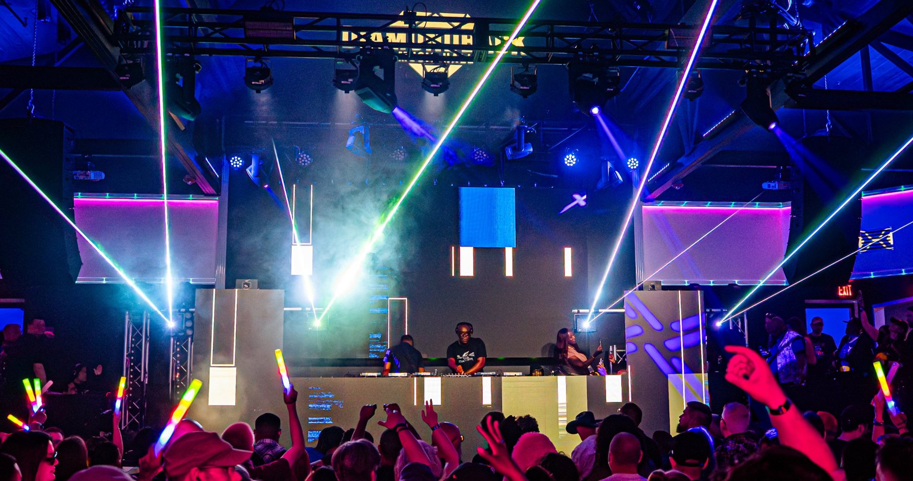 Concert crowd under lasers and projection mapping at Diamondback Music Hall