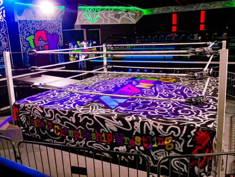 Wide view of the JCW ring and Lunacy banners inside Diamondback Music Hall