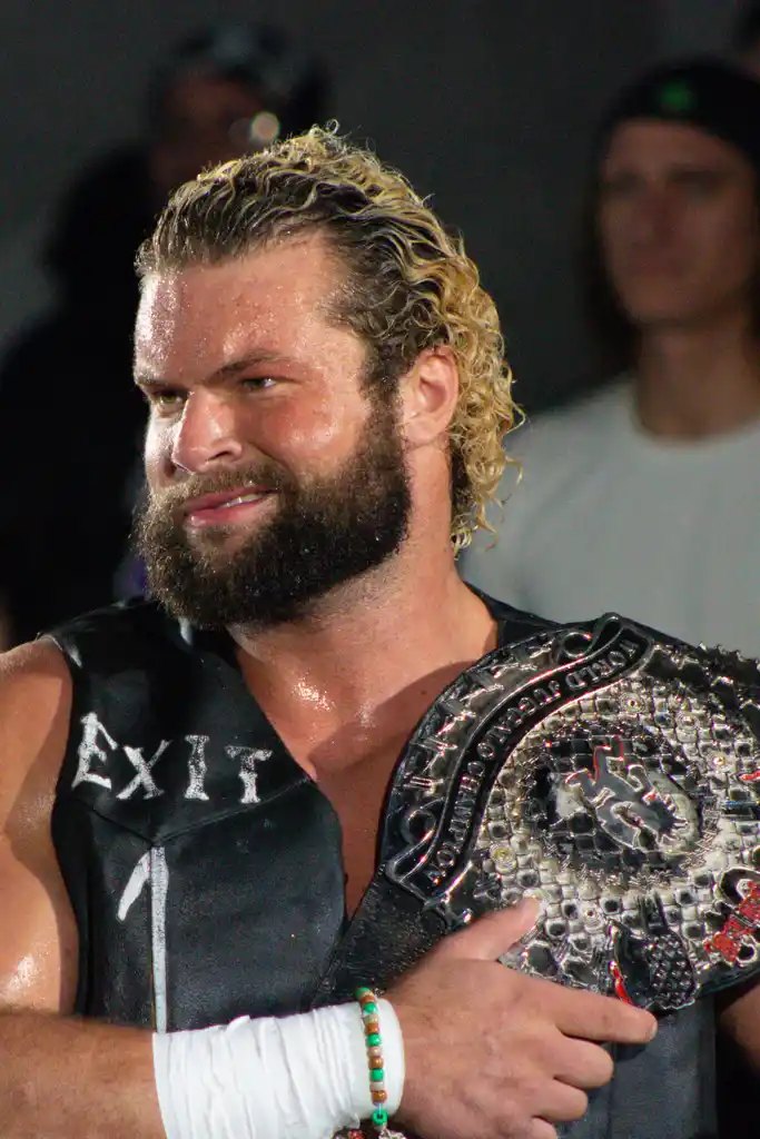 Champion smiling with the belt