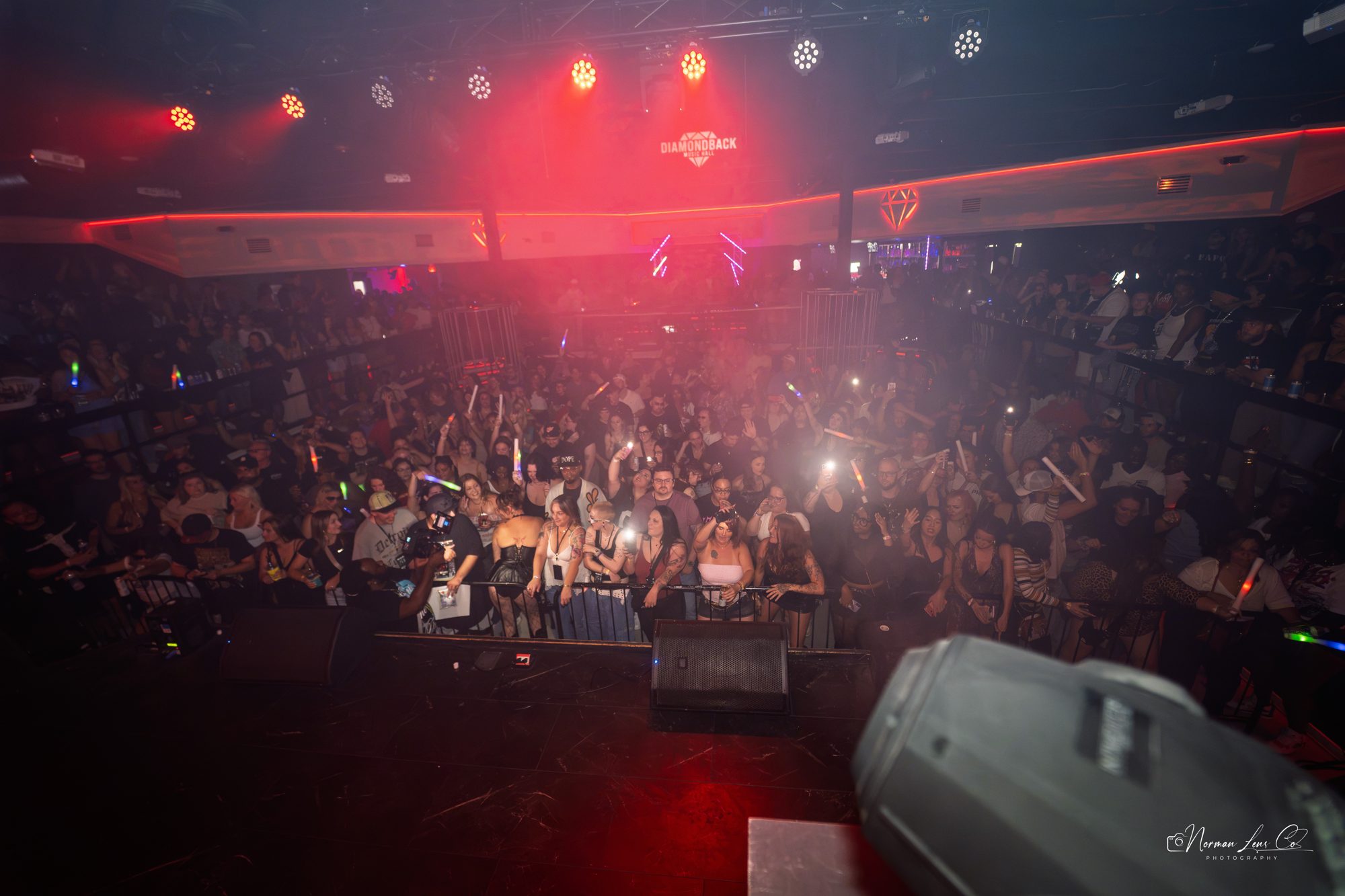 Packed crowd under red lights for Waka Flocka Flame at Diamondback Music Hall