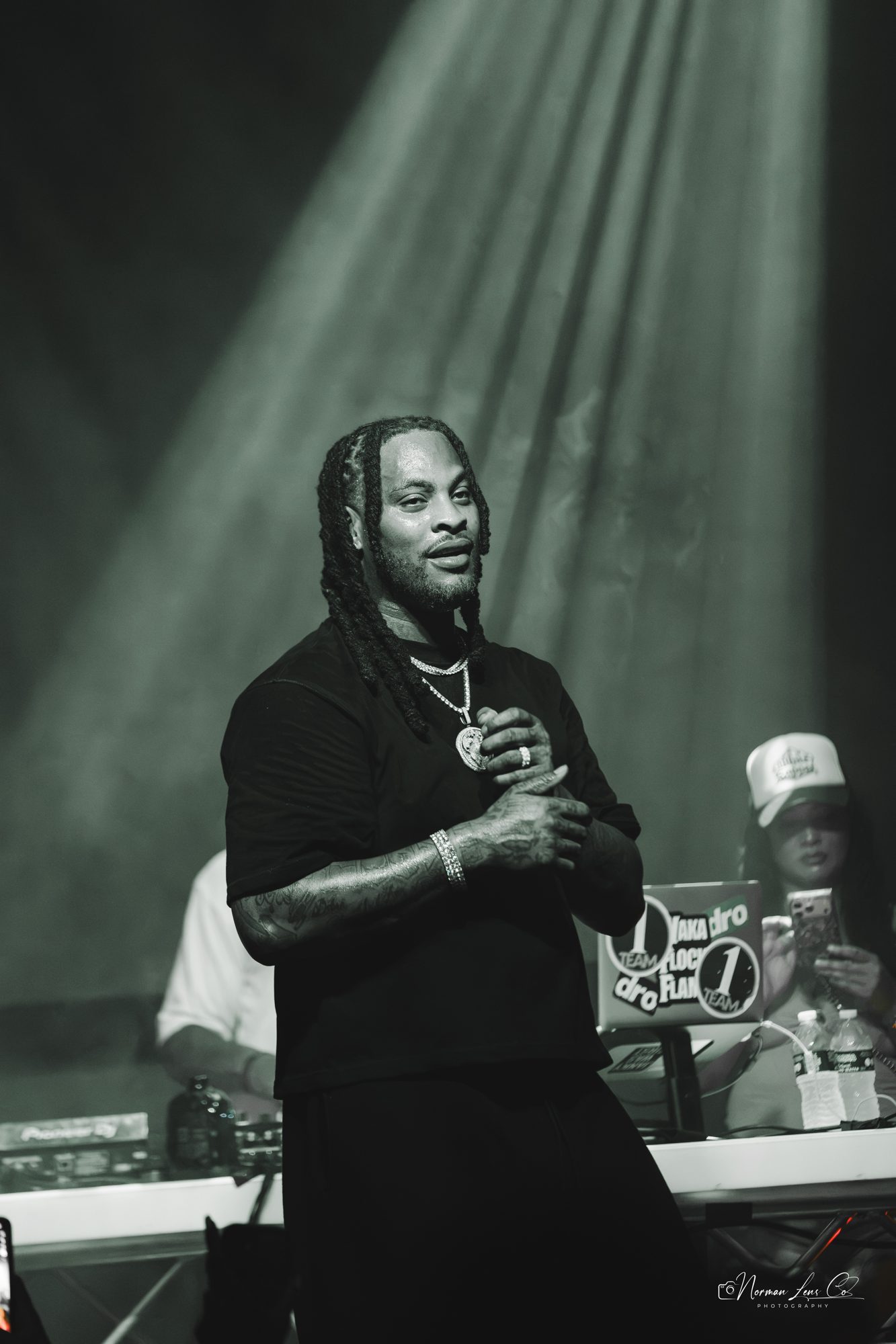 Black and white photo of Waka Flocka Flame under stage lights at Diamondback